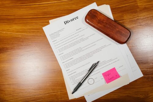divorce papers and wedding rings