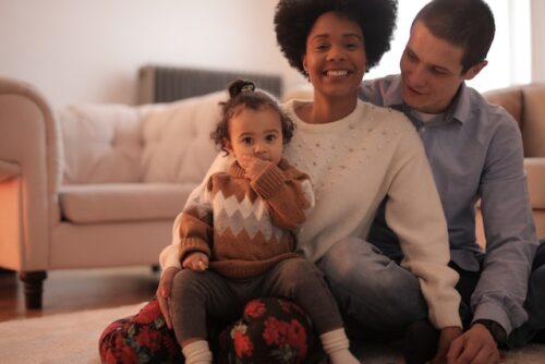 family sitting and smiling