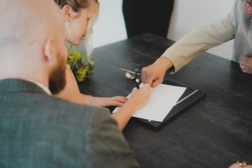 couple signing a document