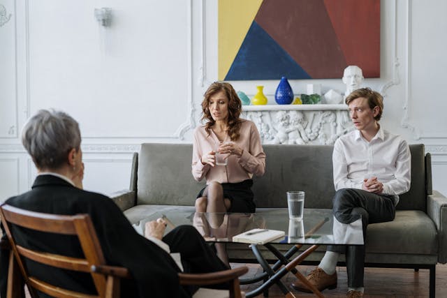 two people meeting with a mediator