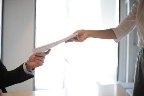 people exchanging documents